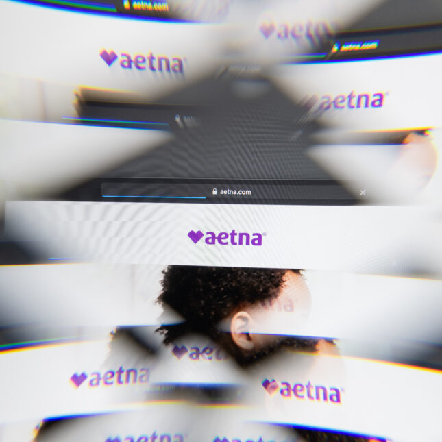 hazy pages of aetna.com layered next to each other, as shown through a kaleidoscopic glass