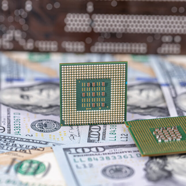 Two computer chips on top of 100 dollar bills — first opinion coverage from STAT