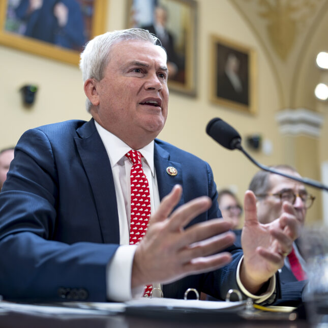 Rep. James Comer, chairman of the House Oversight and Accountability Committee speaks to a microphone while sitting down in a hearing room — politics coverage from STAT