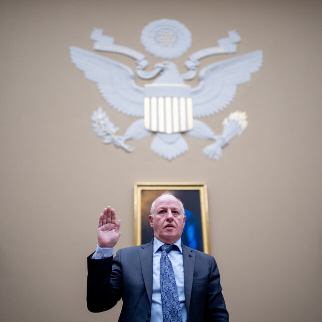 EcoHealth Alliance President Dr. Peter Daszak was sworn in with his right hand up at a House Select Subcommittee, standing against a wall embellished with the logo of the United States House of Representatives — first opinion coverage from STAT