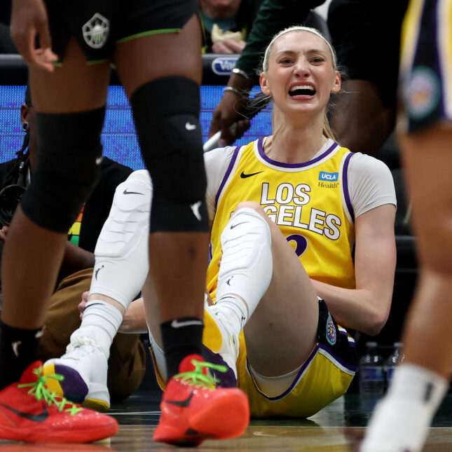 Sitting on the court with both legs curled up slightly, Cameron Brink of the Los Angeles Sparks frown with her mouth open — first opinion coverage from STAT