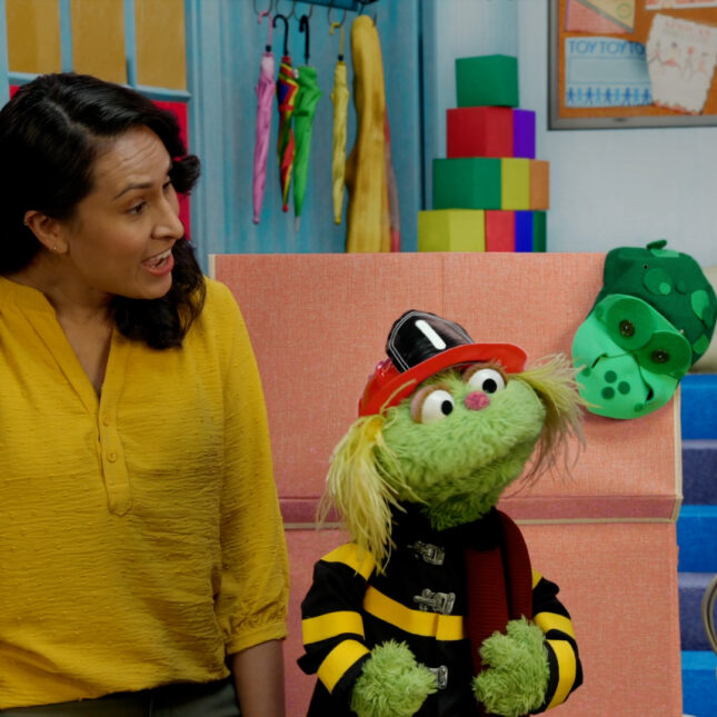 A still image from one of Sesame Workshop's EWB resource videos featuring Elmo, Karli, and Sofia